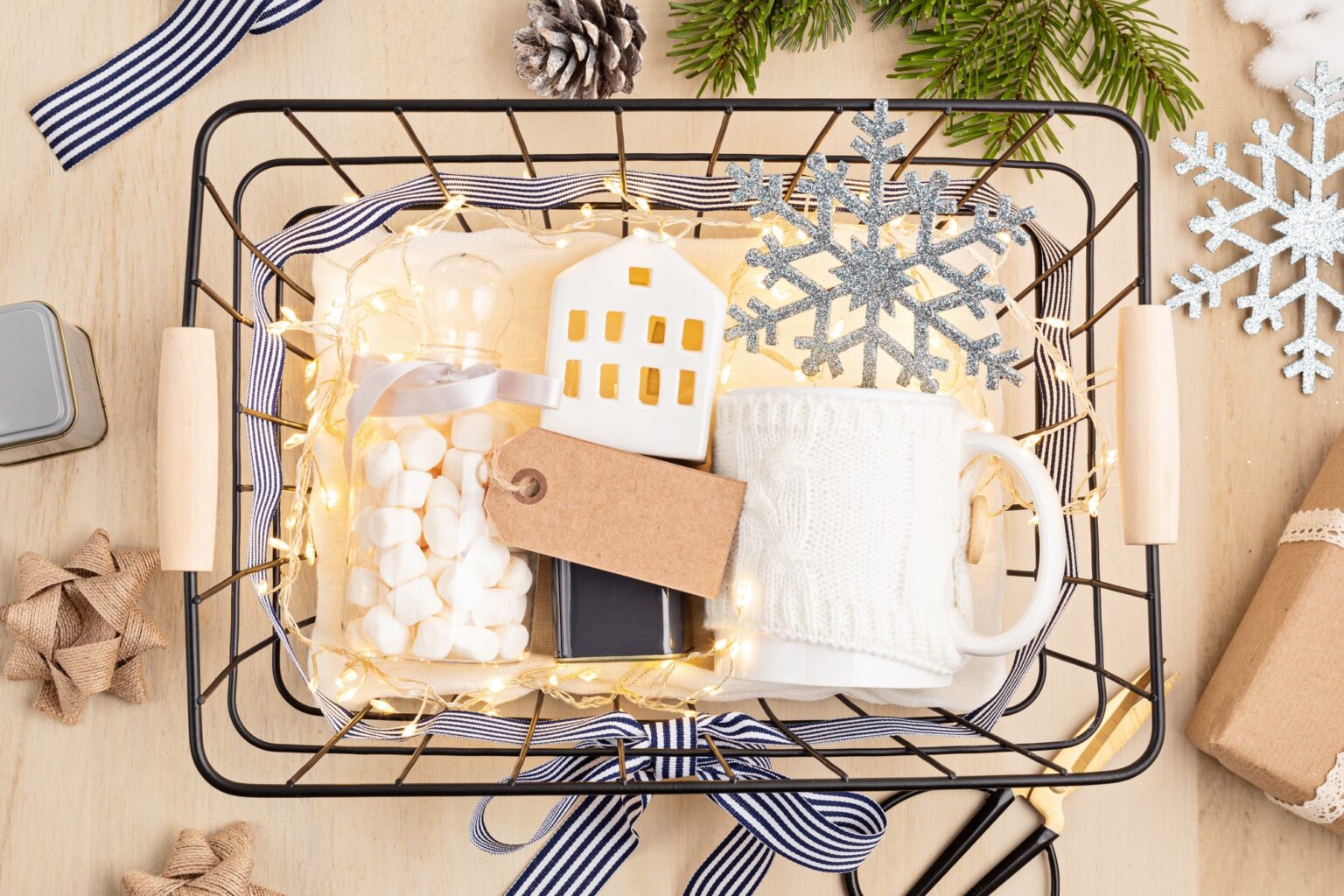 Preparing care package, seasonal gift box with marshmallow, tea,coffee or cacao box and christmas