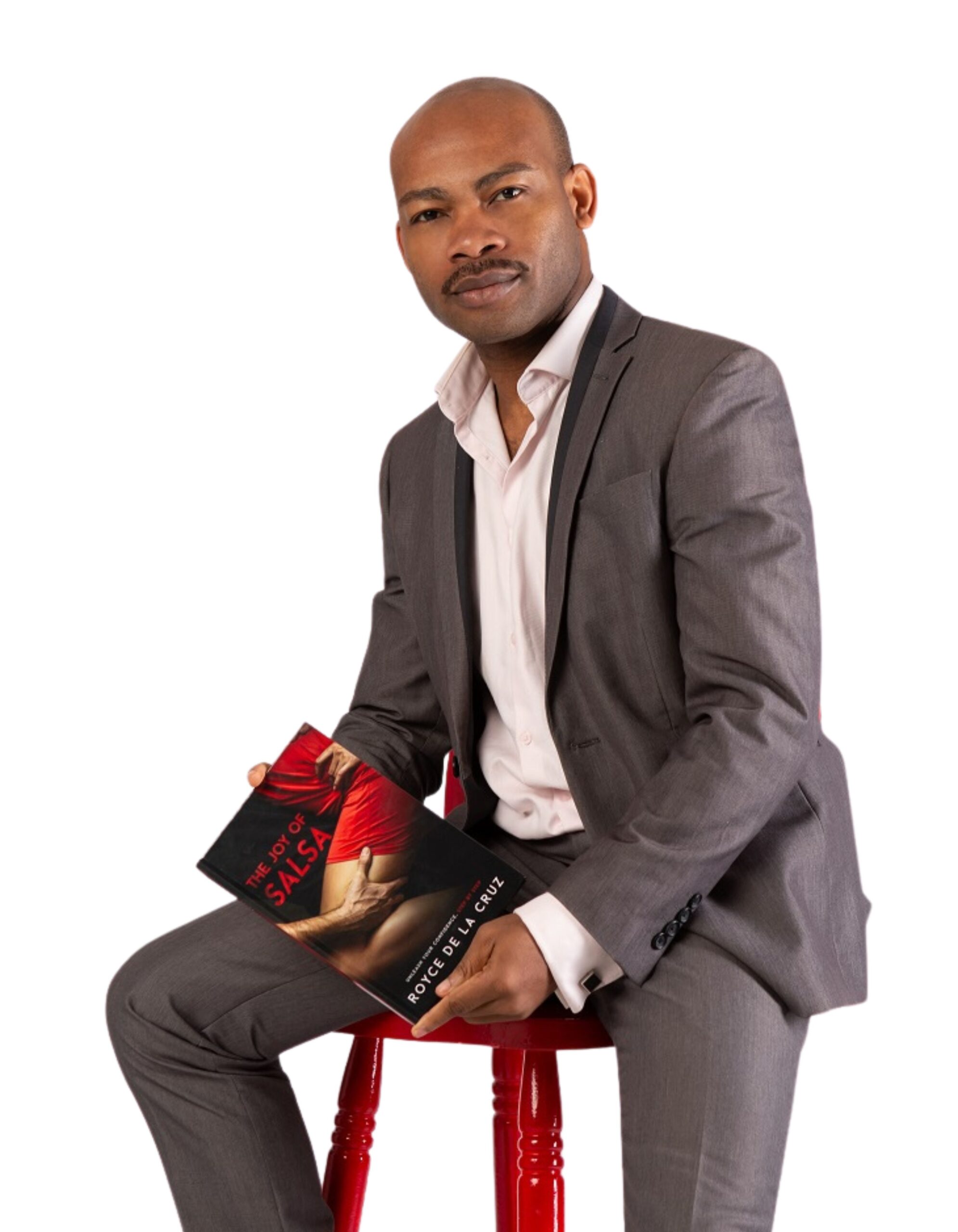 Royce De La Cruz holding his book