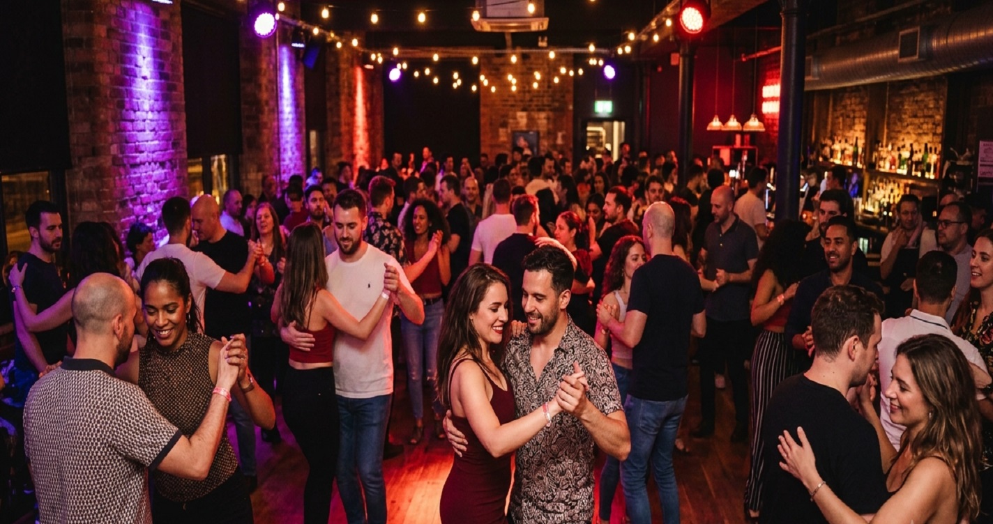 Couples dancing Bachata Sensual in a vibrant, atmospheric Manchester Latin dance club with deep neon lighting - Floridita Dance